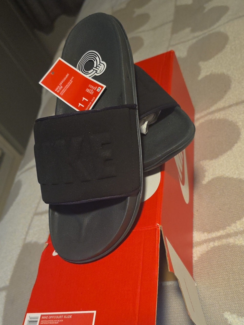 Nike Black Slide Sandals with Embossed Strap